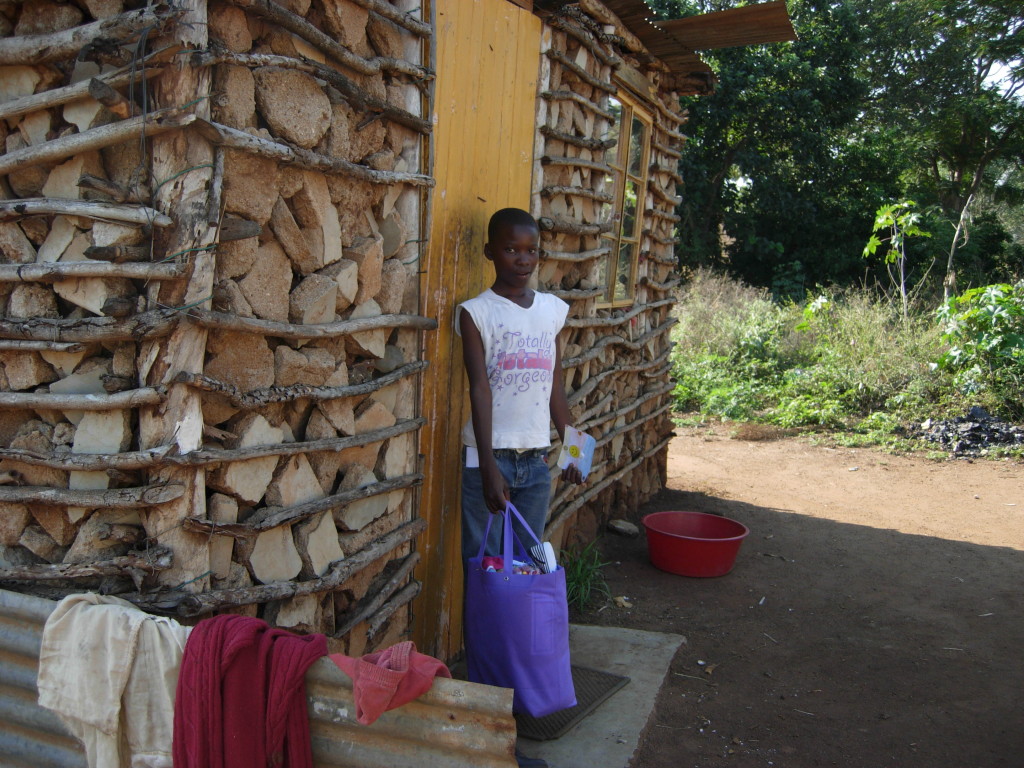 Gcinile in front of her gogo's home in Swaziland.