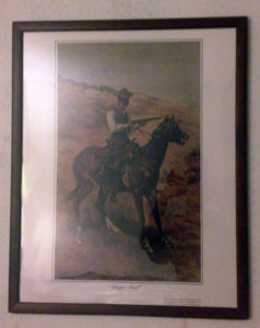 Framed picture of cowboy on horse