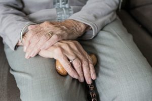 Minding the Home Front--older woman's hands on cane