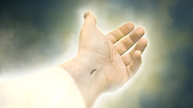 A Sympathetic Savior --Jesus' scarred hand reaches out