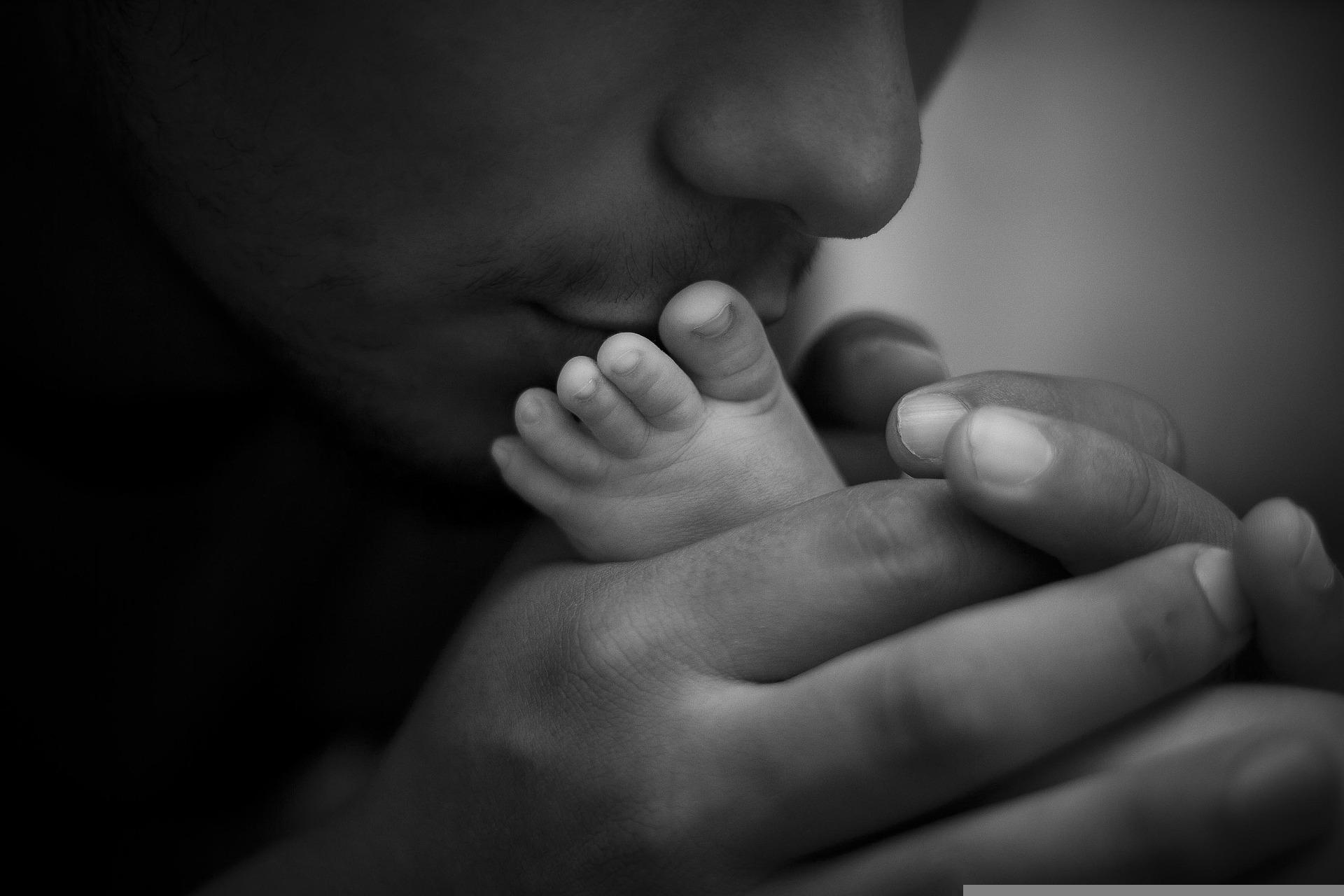 Faith with Feet-father kissing baby's foot