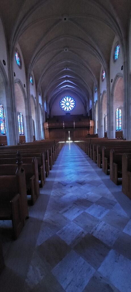 The rose window at the end of the aisle in the Cathedral of St Phillip in Atlanta.