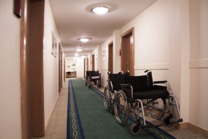 Christmas Presence--wheelchairs in rehabilitation hallway