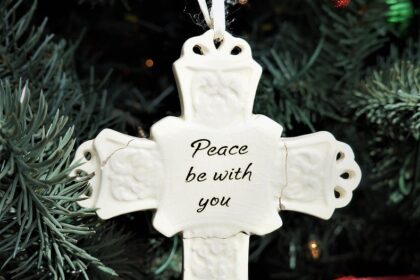 Christmas Presence--White cross Christmas ornament with "Peace be with you" on it
